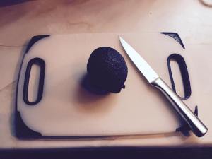 Ripe avocado and a sharp knife